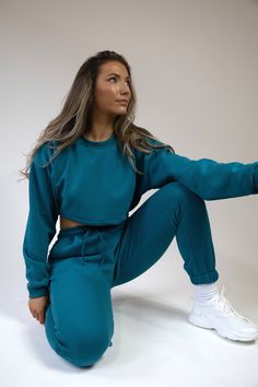 Pea Street has handmade the best quality loungewear for you peas. This teal blue crop brush back sweatshirt jumper is super cute to go with the matching joggers and crop top. Ribbed collar and cuffs. model size 8-10 wearing size 10 handmade to order, high quality fabric. Blue Cropped Crop Top For Loungewear, Blue Cropped Top For Loungewear, Cotton Cropped Sweater For Loungewear, Winter Loungewear Crop Top With Crew Neck, Fall Crew Neck Crop Top For Loungewear, Relaxed Fit Crop Top For Loungewear, Relaxed Fit Long Sleeve Crop Top For Loungewear, Sporty Crop Top For Loungewear With Cropped Hem, Long Sleeve Relaxed Fit Crop Top For Loungewear