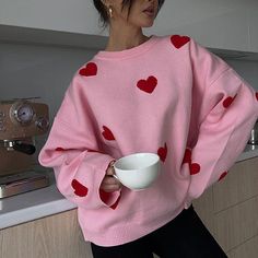 This sweater comes in a knit construction, with a crew neck, ribbed trim, and a heart print all over Size:• S: Bust: 104cm/ 40.9 in, Length: 60cm/ 23.6 in, Sleeves: 52cm/ 20.5 in• M: Bust: 108cm/ 42.5 in, Length: 61cm/ 24.0 in, Sleeves: 53cm/ 20.9 in• L: Bust: 112cm/ 44.1 in, Length: 62cm/ 24.4 in, Sleeves: 54cm/ 21.3 in Material: Polyester Cute Crew Neck Knit Sweater, Trendy Crew Neck Knit Sweatshirt, Trendy Knit Crew Neck Sweatshirt, Oversized Heart Print Sweater For Fall, Cute Heart Graphic Sweater For Winter, Cute Winter Sweater With Heart Graphic, Oversized Heart-shaped Sweater For Winter, Casual Heart Print Winter Tops, Cute Heart Graphic Sweater For Fall