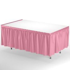 a pink table with a white cover on it