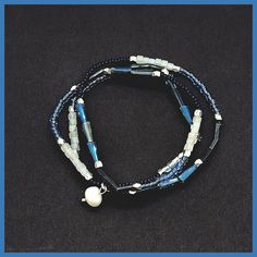 One long strand of colorful beads in shades of blue from navy to sky, plus milky-white round beads and metallic rondels line this stretchy strand that works as a wrap bracelet or a choker! About 18" long, stretches to fit most wrists, no clasp. from Kole Designs Blue Wrap Bracelet With Spacer Beads, Blue Multi-strand Hand-strung Bracelet, Blue Hand-strung Multi-strand Bracelet, Adjustable Blue Wrap Bracelet With Faceted Beads, Blue Multi-strand Hand-strung Beaded Bracelets, Adjustable Blue Wrap Bracelet With Round Beads, Blue Beaded Multi-strand Wrap Bracelet, Blue Multi-strand Bracelets With Spacer Beads, Adjustable Blue Multi-strand Wrap Bracelet