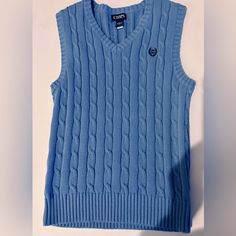 In Excellent Condition . Nwot. Blue Casual Sleeveless Sweater Vest, Casual Blue Knit Vest, Blue Sleeveless Casual Sweater, Blue Cotton Sleeveless Sweater Vest, Casual Blue Winter Tank Top, Casual Blue Tank Top For Winter, Blue Sleeveless Knit Sweater, Blue Sleeveless Winter Top, Blue Sleeveless Top For Winter