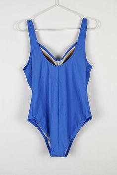 Vintage blue one piece swimsuit in mint condition. Size 46 B/C 80% nylon 20% spandex Padded cups Lined front bust 40 cm = 15.7 in length 70 cm = 27.6 in Blue Bodysuit For Swimming During Beach Season, Solid One-piece Beach Leotard, Blue Nylon Swimwear For Sunbathing, Blue Nylon Summer Swimwear, Stretch Blue Bodysuit For Swimming, Blue One-piece Nylon Swimwear, Blue Nylon One-piece Swimwear, Blue Nylon Tankini For Vacation, Blue Nylon Lined Tankini