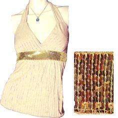 New, Never Used/Washed, Womens Cream/Ivory Sleeveless Halter Top/Blouse With Metallic Gold Striped Glitter Accent - Sleeveless Tops. With Gold Glitter Pinstripes/Striped Pattern Details In The Fabric, And Wide Gold Sequin Trim At Waistline. Top Has An Adjustable Back Neck Tie. Made In Usa. Fabric Material Is 100% Polyester. Womens Tops Great As Casual Wear, Summer Tops, Party Tops, Clubwear, Clubbing / Club Tops, Evening Tops, Etc. Hurry! We Have Limited Stocks Left For All Colors! Color: Cream/ Chic Beige Party Tank Top, Chic Beige Tank Top For Party, Elegant Beige Party Tank Top, Elegant Gold Halter Top For Summer, Gold Tank Top For Evening, Glamorous Gold Halter Top For Summer, Beige Stretch Top For Party, Elegant Sequined Tank Top, Elegant Fitted Gold Tank Top