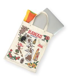 a tote bag with hawaii stickers on it and an oven mitt next to it