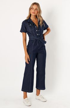 Contrast stitching heightens the utilitarian style of a short-sleeve denim jumpsuit cinched with a matching tie belt. Front button closure Spread collar Short sleeves Chest button-flap patch pockets; front slant pockets; back patch pockets Removable tie belt Unlined 100% cotton Hand wash, dry flat Imported Short Sleeve Denim Jumpsuit, Satin Dresses Long, Blue Playsuit, Satin Dresses Long Sleeve, Black Tie Wedding Guests, White Dress Shoes, Essential Dress, Resort Dresses, Crop Top Tees