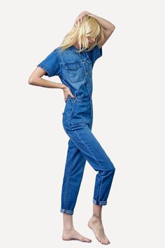 Denim delight for her - this jumpsuit features short sleeves, a button top, and straight legs for easy wear and effortless style. Details Style: Casual Sleeves: Short Neckline: Collar Waistline: Elastic sides Leg Cut: Straight Fabric: 100% Cotton A US design by Insane Gene Size Guide (SIZE S) WAIST - 28 1/2"HIP - 39"FRONT RISE - 13"LEG OPENING - 12 1/2"INSEAM - 28 1/2"CHEST - 40 1/2" The model is wearing a size S MODELHEIGHT 5'10"WAIST 25"HIPS 35" Size Measurement (inch): XS: 26.5 (Waist), 37.0 Short Sleeve Denim Jumpsuit With Pockets, Short Sleeve Denim Jumpsuit For Work, Cotton Denim Jumpsuit With Short Sleeves, Casual Short Sleeve Jumpsuits And Rompers With Pockets, Casual Jumpsuits And Rompers With Pockets, Fitted Denim Jumpsuit With Pockets And Short Sleeves, Casual Short Sleeve Relaxed Fit Jumpsuits And Rompers, Workwear Denim Jumpsuit With Short Sleeves, Casual Short Sleeve Jumpsuits And Rompers With Relaxed Fit