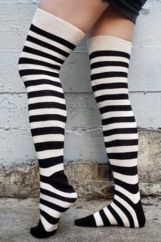 Horizontally striped, thigh high cotton socks with a classic Black and White stripe pattern, what could be better? Soft heavyweight cotton for a stylish and comfortable fit. Thigh high / OTK / Over the Knee Horizontally Ribbed One Size fits most 99% Cotton with less than 1% Nylon in the top of the cuff. Made in USA *Due to the natural fiber content of these socks, they will not stay up long term on their own. To wear them as over the knee style, need to use garters or wear them over leggings or Usa Shoes, Slouchy Style, Wide Stripes, Garters, Be Better, Cotton Socks, Thigh High, Knee High Sock, Thigh Highs