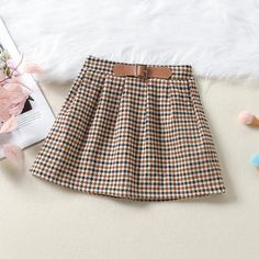 Toddler Kids Girls' Black Sweater Plaid Skirt Two Piece Set - PrettyKid Winter Cotton School Skirt, Winter School Cotton Skirt, Trendy Winter School Skirt, Trendy Winter Skirt For School, Winter School Pleated Skirt, Cute Cotton Skirt For Fall, Brown School Skirt For Fall, Brown Skirt For School In Fall, Sweater Plaid