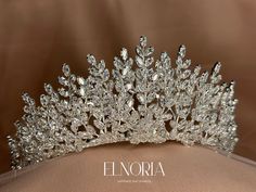 ROYALTY IN STONE SHAPE The marquise shape of the Swarovski crystals in this bridal tiara adds royalty to the look you will have. It is not just the look, but also there are the amazing material choices we've added to this wedding headpiece. Besides Swarovski, this one is also made of cubic zirconia. On your big day, this bridal headpiece will complement the beauty of your white dress because of its stunning silver color.  Materials & Color: Swarovski Crystal, Cubic Zirconia, Silver Plated Size: Bridal Tiara With Veil, Swarovski Tiara, Feel Happier, Beautiful Tiaras, Bridal Hair Piece, Bridal Headpiece, Headpiece Wedding, Wedding Crown, Wedding Headpiece