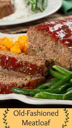 meatloaf on a plate with green beans and carrots