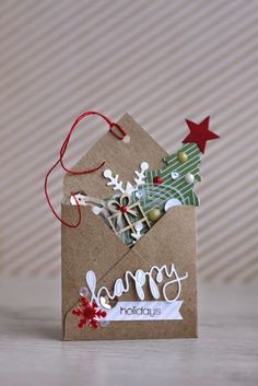 a small christmas card with the words happy holidays on it