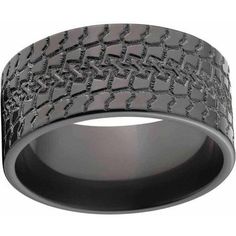 a black ring with an intricate pattern on it