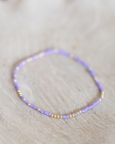 - 2mm gold filled ball beads mixed with color glass seed beads - 6.5 inches Dainty Purple Beaded Bracelets With Round Beads, Dainty Purple Beaded Bracelet With Round Beads, Dainty Purple Beaded Bracelet, Gold Rondelle Beaded Bracelets With Colorful Beads, Gold Heishi Beaded Necklaces, Gold Heishi Beads Necklace, Gold Rondelle Beaded Bracelets With Tiny Beads, Stacked Jewelry, Glass Seed Beads