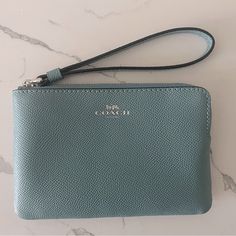 Nwot Coach Wristlet Coach Corner Zip Wristlet Color: Light Teal / Silver Model: 58032 Crossgrain Leather Silver Logo Two Credit Card Slots Zip-Top Closure, Fabric Lining Wrist Strap Attached 6 1/4" (L) 4" (H) 1/2" (W) Coach Blue Clutch For Everyday Use, Blue Coach Clutch For Everyday Use, Coach Blue Pouch Wristlet, Blue Coach Pouch Wristlet, Blue Coach Wristlet For Daily Use, Coach Blue Wristlet For Daily Use, Blue Travel Wristlet With Removable Pouch, Blue Wristlet With Removable Pouch For Travel, Blue Wristlet With Zipper Pouch For Daily Use