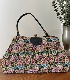 1960s Floral Tapestry Top Handle Convertible Handbag, 60s Vintage Purse, Vintage Accessory  Two in one handbag from the 1960s. The outer cover of the handbag is a floral tapestry that easily snaps off for a sleek black handbag. It has a single black vinyl handle strap. Gold tone metal frame with a thumb lift closure that works well and closes tightly. Opens to a black vinyl lining. Nearest mint condition *the exterior is immaculate.  The lining is immaculate with no stains or holes.  The metal h Vintage Rectangular Bags For Vintage Events, Vintage Rectangular Bags For Events, Retro Rectangular Evening Bag For Vintage Fashion, Vintage Rectangular Evening Bag, Retro Satchel Bag For Vintage Fashion, Retro Rectangular Evening Bag, Vintage Rectangular Shoulder Bag With Removable Pouch, Vintage Multicolor Satchel With Removable Pouch, Vintage Satchel With Removable Pouch And Top Handle