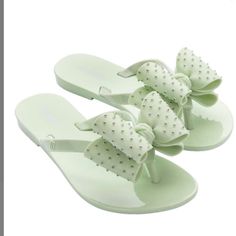 Mini Melissa New Cute Green Open Toe Sandals, Cute Synthetic Jelly Sandals For Summer, White Plastic Slide Sandals, Playful Plastic Sandals For Spring, Adjustable Flat Synthetic Jelly Sandals, Adjustable Flat Jelly Sandals In Synthetic Material, White Round Toe Jelly Sandals, Cute Flat Heel Synthetic Sandals, Spring White Plastic Jelly Sandals