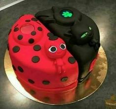 two cakes decorated to look like ladybugs sitting on top of eachother