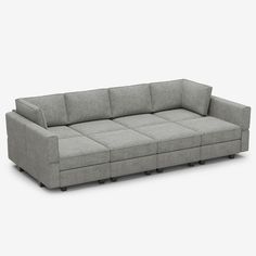 a gray couch sitting on top of a white floor