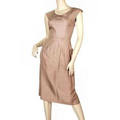 Natural silk in a rich mocha color makes up this lovely vintage dress; darted bodice and cap sleeves with front and back scoop neckline. It has major hip details as seen in photo with a straight pencil skirt hem. The dress has a waist to below the hip lining to add strength to that area. The bolero style collar is made of the same fabric but lined in iridescent peach taffeta. It has a rhinestone button at the little tab on the princess collar. DRESSMarked Size: None Bust: 33" Waist: 25" Hips: 40 Silk Vintage Dress, Vintage Wiggle Dress, Bolero Style, Silk Dress Vintage, Silk Cocktail Dress, Mocha Color, Wiggle Dress, Natural Silk, Vintage Dress