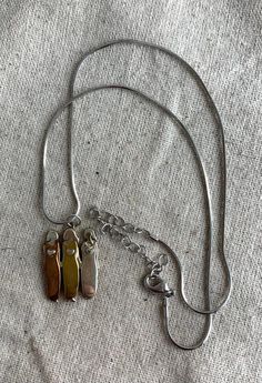 "You will receive this beautiful Three Sisters pendant necklace from Mama and Oly. The chain measures 18\" with a 3\" extender and the pendant measures 1 1/8\" x 3/4\" and features three women in different metal tones with hearts on their chests. The pendant is signed on the back. This necklace is in very good vintage condition with minimal signs of wear. For finished vintage assemblage and vintage inspired necklaces, bracelets, and earrings, please visit us at our other Etsy store, William Dalt Metal Necklaces For Friendship, Metal Friendship Necklaces, Friendship Pendant Necklace With Adjustable Chain, Personalized Metal Pendant Chain Necklace, Metal Charm Necklace For Friendship, Metal Charm Necklaces For Friendship, Metal Friendship Charms Necklace, Metal Charm Necklace With 16 Inch Pendant, Metal Charm Necklace With 16 Inch Length