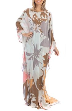 When you need a light layer, this drapey floral kaftan with a V-neckline is always the right choice. 100% rayon Hand wash, line dry Imported Model stats: 5'10" height, 32" bust, 25" waist, 36" hip. Model is wearing size One Size. Floral Print Flowy Maxi Cover-up, Flowy Rayon Kaftan For Beachwear, Casual Silk Kaftan For Spring, Casual Silk Kaftan For The Beach, V-neck Viscose Kaftan For The Beach, Spring Viscose Tunic Kaftan, Flowy Floral Print Maxi Length Cover-up, Multicolor Rayon Kaftan For Spring, Spring Multicolor Rayon Kaftan