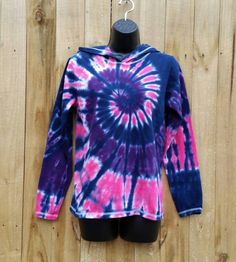 Every women's long sleeve hoodie was hand dyed with permanent fiber reactive dyes. On a new 100 % cotton adult unisex long sleeve tshirt hoodie in a size of your choosing A great layering piece that is super soft and comfy. Dyed in a vibrant mix of pink, purple and navy! Put some color into your wardrobe, buy tie dye :-) Available Sizes S ( 30-32) M (34-36) L (38-40) XL (42-44) 2XL (46-48) *As always all tie dyes are hand dyed with permanent fiber reactive dyes. So they will stay bright and vibr Acid Wash Long Sleeve Hoodie, Acid Wash Cotton Hooded Top, Tie-dye Hoodie With Drawstring Hood, Tie Dye Long Sleeve Cotton Hoodie, Tie Dye Cotton Long Sleeve Hoodie, Tie Dye Cotton Top With Drawstring Hood, Tie-dye Hooded Top With Drawstring, Hooded Tie Dye Top For Fall, Crew Neck Tie-dye Hoodie For Winter