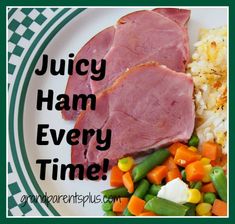 a white plate topped with ham and veggies next to rice on a green and white checkered table cloth