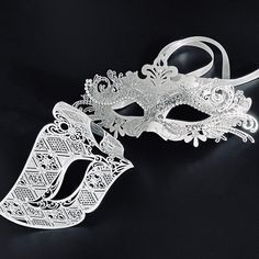 The simple masquerade mask for men comes in white with silver glitter, the mask for women in white silver is specially decorated around the eyes to exaggerate shimmering, intricate mascara. White Masks For Mardi Gras Costume Party, White Masquerade Masks And Prosthetics For Mardi Gras, White Masks And Prosthetics For Mardi Gras Masquerade, White Masquerade Mask For Mardi Gras Costume Party, Silver Masks And Prosthetics For Mardi Gras Party, Elegant Silver Masks And Prosthetics For Party, Silver Mask For Mardi Gras Evening, White Masks For Carnival Party, Elegant White Party Masks And Prosthetics