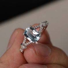 This is a gorgeous handmade creation. Its beauty is its simplicity & Elegance. The 6*8mm cushion cut natural aquamarine is crafted in sterling silver with rhodium plated. It's made to order and it will take about 7-10 days to make it. All item is sent in a beautiful gift box You can realize more lovely stuff clicking the link https://www.etsy.com/shop/knightjewelry?refshopsection_shophome_leftnav Please leave the correct address and you phone number for delivering successfully. White Gold Blue Topaz Cushion Cut Ring, Cushion Cut Aquamarine Gemstone Jewelry, Aquamarine Gemstone Ring In Radiant Cut, Aquamarine Gemstone Ring With Radiant Cut, Radiant Cut Aquamarine Gemstone Ring, White Gold Aquamarine Ring With Gemstone Accents, Silver Aquamarine Jewelry With Asscher Cut, White Gold Rings With Aquamarine Gemstone Accents, Engagement Ring Split Shank