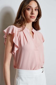 The soft cap sleeves lend a femme twist to this luxe georgette top. With its contour pleat detail neckline, it is perfect for layering with your favorite blazer or wearing on its own. T-Tahari Short Sleeve V-Neck Top Runs true to size. Model is 5'9" and wearing size S Dry Clean Only Imported Style #: THF44013 Feminine Flutter Sleeve Blouse, Elegant Ruffle Sleeve Blouse For Work, Chic Flutter Sleeve Blouse For Work, Chic Ruffle Sleeve Tops For Work, Chic Workwear Blouse With Flutter Sleeves, Elegant Short Sleeve Tops For Office Wear, Chic Short Sleeve Tops For Office Wear, Fitted Ruffle Sleeve Blouse For Work, Feminine Fitted Tops With Flutter Sleeves