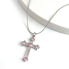 Expertly crafted with stainless steel, this pendant necklace features a bold cross design adorned with a beautiful pink zircon stone. Perfect for both men and women, this piece adds a touch of elegance to any outfit. Fall in love with the durability and stunning design of this necklace. Pendant Size :45.5 cm chain(as show Pendant) Chain Size: 24 inches Metal Stamp: Stainless Steel,Copper and Pink Zircon Stones Color: silver Y2k Cross, Pink Zircon, Copper And Pink, Jewelry Style, Girl Friend, Jewelry Model, Stone Pendant Necklace, Girls Necklaces, Anniversary Party