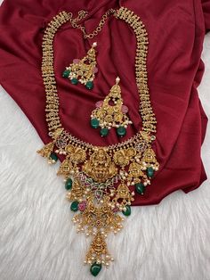 Matte Nakshi Goddess lakshmi Long Haar Necklace in Antique Finish with Green Beads and Pearls. Traditional Matte Necklace. Pair it up Silk saree or lehenga Necklace Length : 24 Inches; comes with adjustable back chain. Earring Length : 2.25 Inches Approx. Push Back  Ready to ship from Boston, Massachusetts. If you have any questions let me know. Thank you!! Gold Kundan Necklace With Zari Work, Gold Zari Weaving Jewelry For Weddings, Bollywood Style Gold-plated Temple Necklace With Latkans, Festive Gold Jewelry With Zari Weaving, Gold Wedding Jewelry With Zari Weaving, Gold Kundan Necklace With Zari Work For Puja, Traditional Gold Kundan Necklace With Drape, Bollywood Jewelry With Zari Weaving For Wedding, Gold Plated Temple Necklace With Latkans For Diwali