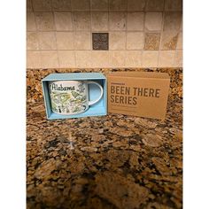 a coffee mug in a box sitting on top of a counter