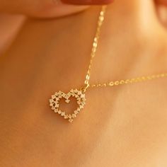 "Heart necklace / solid gold heart necklace / dainty moissanite necklace / minimalist love necklace / yellow gold moissanite heart pendant SKU: Ins028 Materials: Solid Yellow Gold, Solid Rose gold, Solid White gold, Platinum Length = 16/17/18/19/20inches (If you need another length to feel free to ask). Stone Type: Moissanite Stone Size: Can be customized If you have any additional questions about this necklace, just hit the \"Message Seller\" and we will get back you within a few hours. Be sure Dainty Round Heart Necklace Tarnish Resistant, Mother's Day Dainty Diamond Accent Necklaces, Mother's Day Dainty Necklace With Diamond Accents, Heart Pendant Diamond Necklace With Delicate Chain For Anniversary, Dainty Diamond Heart Pendant Necklace, Dainty Heart Pendant Necklace With Diamond Accents, Dainty 14k Gold Diamond Heart Pendant Necklace, Delicate Cubic Zirconia Necklace For Mother's Day, Dainty 14k Gold Heart Pendant Diamond Necklace