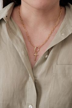 Details: - 18K Gold Filled Paperclip chain - Chain link size: Approx. 8mm x 3mm - Plain Cross pendant size: 24mm x 12mm - CZ Cross pendant size: 22mm x 8mm - Toggle clasp: Gold Plated. - Toggle Bar: 25mm - Toggle Outer Ring: 15mm and Inner Ring: 11mm *NOTE: For your information, necklace length is the total length of the finished product. It is not just the chain.  For example, if you would like to have 17" necklace, we make 17" total length including the toggle clasp so the chain itself will be Gold Paperclip Clavicle Chain Necklace, Dainty Gold Toggle Necklace With Lobster Clasp, Gold Minimalist Necklace With Toggle Clasp, Minimalist Gold Necklace With Toggle Clasp, Minimalist Gold Chain Necklace With Cross Pendant, Minimalist Yellow Gold Chain Necklace With Toggle Clasp, Elegant Cross Necklace With Lobster Clasp, Yellow Gold Link Necklace With Toggle Clasp, Yellow Gold Lariat Necklace With Toggle Clasp