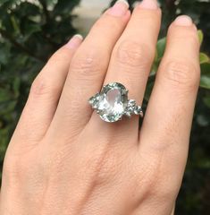 "A Swoon-Worthy Large Oval-Shape faceted Genuine Green Amethyst flanked with petite round Genuine Green Sapphires is a stunning engagement/promise/February Birthstone Ring for Her. Wrapped in a box ready for gift-giving. (r-egt-45) Instagram Video ----------------- https://www.instagram.com/p/Bx2_GShhy5l/?igshid=obtnbkeifnv2 Ring Info ----------------------- Green Amethyst measure 10.5mm x 12.5mm Green Sapphire measure 3mm Customize it the ring using any material or gemstones, just convo us with Green Amethyst Wedding Rings With Gemstone Accents, Green Amethyst Rings With Gemstone Accents For Wedding, Green Amethyst Jewelry With Gemstone Accents, Oval Green Amethyst Ring For Anniversary, Oval Green Amethyst Ring Gift, Oval Faceted White Gold Rings, Oval Green Amethyst Jewelry With Gemstone Accents, Fine Jewelry Rings With Green Amethyst Gemstone Accents, Oval Faceted Gemstones For Fine Jewelry