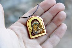 Check out this item in my Etsy shop https://www.etsy.com/listing/719061442/virgin-mary-theotokos-pendant-hand Painting Wood