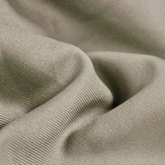 Delaney GREY Polyester Gabardine Fabric by the Yard for Suits, Overcoats, Trousers/Slacks, Uniforms - 10056 Prominent diagonal rib on the face and and smooth surface on the back. Gabardine is a tough, tightly woven fabric used to make suits, overcoats, trousers, uniforms, windbreakers and other garments. Content: 100% polyester Stretch: Minimal to none Width: 58 to 60 inches Weight: 280 Grams per Square Meter Edge: Straight Uses: Suits, overcoats, trousers, uniforms, costumes, crafts, etc. DISCLAIMER: Expedited shipping options do not apply to 5, 10, 50 and 100 yard options. Sample/Swatch: 4x2 inches for $4.99 each, free shipping. We highly suggest buying a sample first to see and feel the fabric if you are unsure of the color before buying yards. Wholesale: 20 yards or more per color Cut Gabardine Fabric, Cut And Color, Fabric By The Yard, Woven Fabric, The Face, Angeles, Trousers, Craft Supplies, Grey