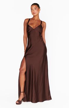 Raise a glass in the Anderson Maxi Dress! Sleek, chocolate satin shapes this chic dress with an open back and criss cross ties. This flattering, floor length dress exudes glamour. Style with strappy heels and dainty gold jewelry for your next event. Tan Bridesmaid Dresses, Beige Bridesmaid Dress, Maternity Dress Wedding Guest, Brown Dresses Formal, Neutral Bridesmaid Dresses, Maternity Bridesmaid Dresses, Floral Bridesmaid Dresses, Plus Size Mini Dresses, Tulle Sleeves