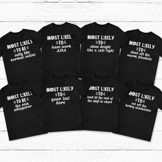 six black shirts with white writing on them