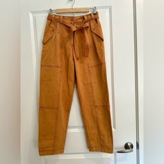 Soft Orange Denim Trouser With Removable Belt And Deep Pockets. Comes With An Extra Button. Brown Paperbag Waist Bottoms For Work, Casual High Rise Belted Pants, Belted Cotton Utility Bottoms, Utility Style Belted Cotton Bottoms, Spring Brown Jeans With Belt Loops, Brown Jeans With Belt Loops For Spring, Brown Workwear Jeans With Belt Loops, Brown Jeans With Belt Loops For Work, High Rise Brown Jeans For Workwear