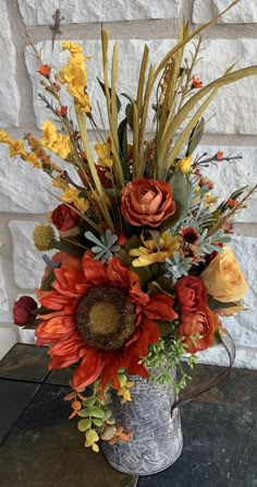 a metal bucket filled with lots of flowers