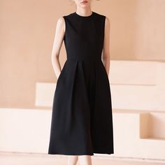 A sleeveless dress with a gently flared hem that gives you the look of a movie actress. This item is sewn high at the waist and creates a beautiful silhouette. Wear it with a cardigan or jacket for all seasons. 
 
 
 
 
 
 
 
 
 
 
 
 
 
 
 
 Size 
 
 
 S size 
 
 
 Length: 110cm 
 Shoulder width: 36cm 
 Bust: 85cm 
 Waist: 68cm 
 
 M size 
 
 Length: 111.5cm 
 Shoulder width: 37cm 
 Bust: 89cm 
 Waist: 72cm 
 
 L size 
 
 Length: 113cm 
 Shoulder width: 38cm 
 Bust: 93cm 
 Waist: 76cm 
 
 XL si Chic A-line Sleeveless Dress With Box Pleat, Spring Sleeveless A-line Dress With Pleated Back, Chic A-line Tea Length Dress With Pleated Bodice, Elegant Sleeveless A-line Fit And Flare Dress, Elegant A-line Fit And Flare Sleeveless Dress, Chic Workwear Dress With Box Pleat, Chic Sleeveless A-line Dress With Box Pleat, Chic Formal Sleeveless Dress With Box Pleat, Chic A-line Dress With Box Pleat