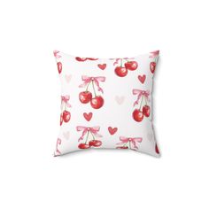 a pillow with hearts and cherries on it