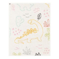 a white rug with dinosaurs and leaves on it