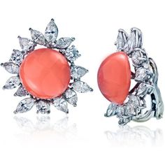 Transport yourself back to the glamorous 1960s with these exquisite Platinum 8.00 Carat Diamond And Coral Earrings. Meticulously crafted in platinum, these earrings are a true testament to timeless beauty and sophistication.The design features a captivating combination of pear-cut, marquise-cut, and round diamonds, each carefully selected to dazzle with their brilliance. The center corals, with their alluring round cabochon cuts, add a pop of vibrant orange color that is simply mesmerizing.With Coral Earrings, Cabochon Jewelry, Platinum Metal, Vibrant Orange, Marquise Cut, Bright Orange, Estate Jewelry, Timeless Beauty, Precious Metals