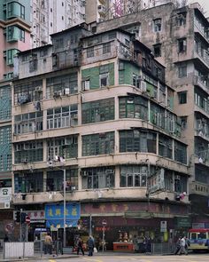 an old building with lots of windows and balconies on the side of it