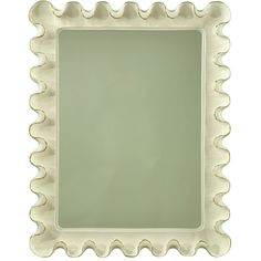 a square mirror with scalloped edges on a white background