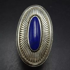 MARCO BEGAYE (NAVAJO) BLUE LAPIS LAZULI STERLING SILVER RING DESCRIPTION:  A gorgeous ring and a rare find by Marco Begaye, this ring will be a treasured addition to your collection of fine vintage Southwestern and Native American jewelry. MEASUREMENTS:  Ring face measures 1 3/8" x 3/4" Cabochon measures 19mm x 7mm RING SIZE: 7 WEIGHT: 12.5 grams SIGNED: MB, for Marco Begaye (Dine') STERLING:  yes, stamped STERLING Jewelry Measurements, Gorgeous Ring, Blue Lapis Lazuli, Blue Lapis, American Jewelry, Native American Jewelry, Ring Size 7, Rings Statement, Lapis Lazuli