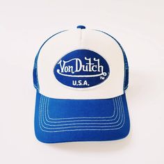 DEADSTOCK VON DUTCH CAP 100% AUTHENTIC vintage white and blue Von Dutch cap / Von Dutch Cap / Von Dutch trucker cap.  embroidered classic white and blue Von Dutch logo on front.  Great condition. 90s Y2K Cap FULLY TRACKED SHIPPING SERVICE. UK AND WORLDWIDE SHIPPING. Retro Blue Baseball Hat, Vintage White Baseball Cap With Curved Bill, Vintage White Trucker Hat With Letter Print, Vintage White Baseball Cap With Letter Print, Blue 5-panel Trucker Hat For Baseball Season, Vintage White Snapback Hat With Letter Print, Retro White Trucker Hat With Letter Print, White Vintage Hats For Baseball Season, Blue Trucker Hat With Letter Print And Curved Brim